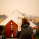 Suzanne Kaksonen, an evacuee of the Camp Fire, and her cockatoo Buddy in the Walmart parking lot in Chico, California.